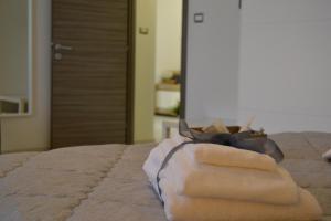 Postel nebo postele na pokoji v ubytování Il profumo dei Sassi Holiday Home