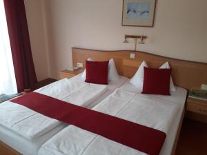 מיטה או מיטות בחדר ב-Ferien- und Aktivhotel Zum Arber