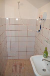 a bathroom with a sink and a shower at Casa cu Castan in Eforie Nord +12 photos