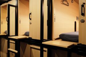 Ein Bett oder Betten in einem Zimmer der Unterkunft THE CAPSULE Myeongdong