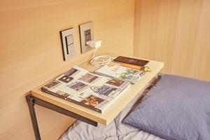 Ein Bett oder Betten in einem Zimmer der Unterkunft THE CAPSULE Myeongdong