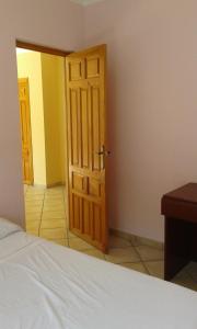 a bedroom with a bed and a wooden door at RIVIERA in Benicàssim