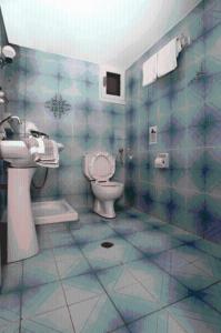 a bathroom with a toilet and a sink at Nautilus Apartments in Sissi