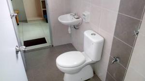 a bathroom with a toilet and a sink at Tropicana Home Concept@Saujana KLIA, Sepang in Sepang +47 photos