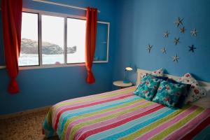 Ένα ή περισσότερα κρεβάτια σε δωμάτιο στο Casa Azul Holiday Home