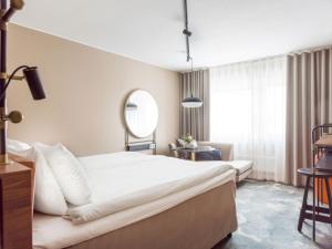 Katil atau katil-katil dalam bilik di Clarion Hotel Winn