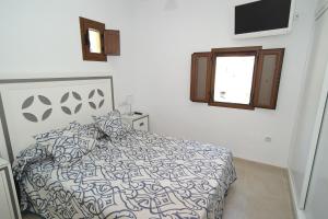 Posteľ alebo postele v izbe v ubytovaní AR35 Coqueto apartamento en primera línea del casco antiguo