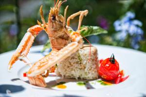 a plate of food with a shrimp and rice at Grand Hotel Il Ninfeo in Gaeta