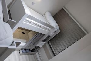 Postel nebo postele na pokoji v ubytování Travel Inn Hostel