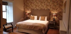 Voodi või voodid majutusasutuse The Listowel Arms Hotel toas