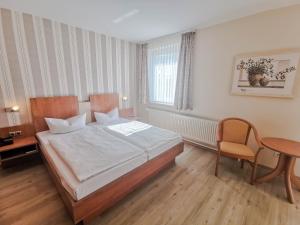 Postel nebo postele na pokoji v ubytování Wald-Hotel