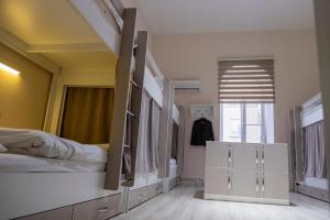 Postel nebo postele na pokoji v ubytování Travel Inn Hostel