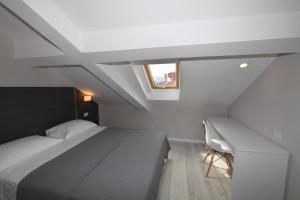 Ліжко або ліжка в номері Promenade Hotel
