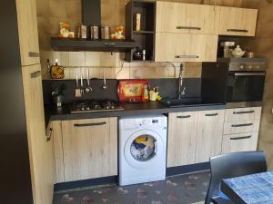 a kitchen with a washer and a washing machine at Remig Ranch CIR 0001 in Challand Saint Victor +30 photos