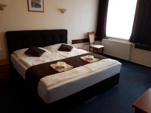 Posteľ alebo postele v izbe v ubytovaní Garni Hotel Tatramonti