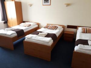 Posteľ alebo postele v izbe v ubytovaní Garni Hotel Tatramonti