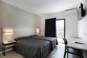 Postel nebo postele na pokoji v ubytování Hotel Brasil