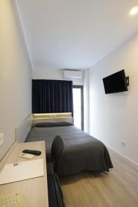 Postel nebo postele na pokoji v ubytování Hotel Brasil
