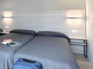 Postel nebo postele na pokoji v ubytování Hotel Brasil