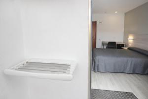 Postel nebo postele na pokoji v ubytování Hotel Brasil