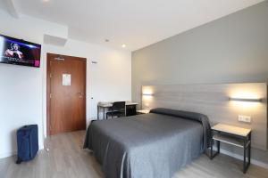 Postel nebo postele na pokoji v ubytování Hotel Brasil