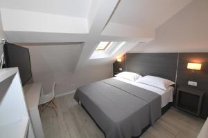 Ліжко або ліжка в номері Promenade Hotel