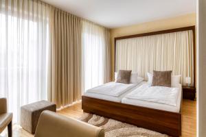 Postel nebo postele na pokoji v ubytování Hotel F-RITZ