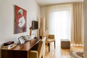 TV a/nebo společenská místnost v ubytování Hotel F-RITZ