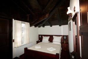 Postel nebo postele na pokoji v ubytování Family hotel Makedonska Kruchma