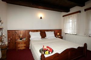 Postel nebo postele na pokoji v ubytování Family hotel Makedonska Kruchma