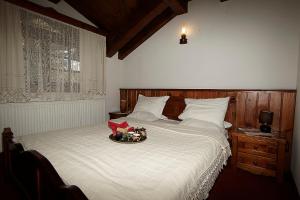 Postel nebo postele na pokoji v ubytování Family hotel Makedonska Kruchma