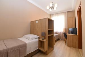 Ліжко або ліжка в номері Promenade Hotel