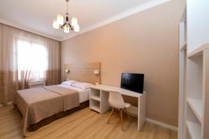Ліжко або ліжка в номері Promenade Hotel