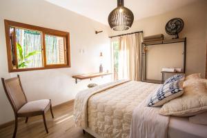 Katil atau katil-katil dalam bilik di Vilarejo Guesthouse - Silêncio e Aconchego