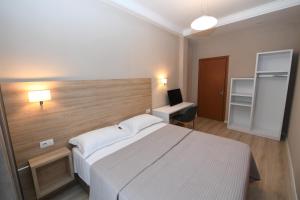 Ліжко або ліжка в номері Promenade Hotel