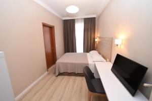 Ліжко або ліжка в номері Promenade Hotel