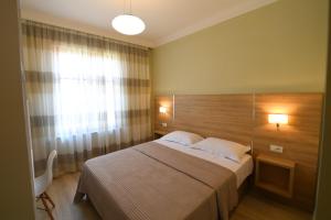 Ліжко або ліжка в номері Promenade Hotel