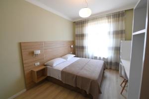 Ліжко або ліжка в номері Promenade Hotel