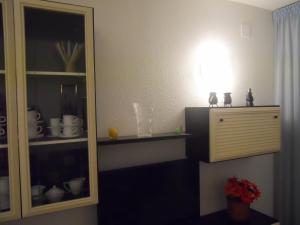 a kitchen with a shelf and a light on the wall at San Francisco - Fincas Arena in Benidorm