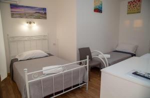 Postel nebo postele na pokoji v ubytování Sea Beach Pozzallo