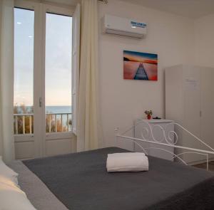 Postel nebo postele na pokoji v ubytování Sea Beach Pozzallo
