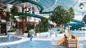 a mall with a water park and a slide at Pite Havsbad Piteå in Piteå