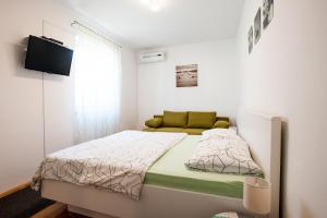 Posteľ alebo postele v izbe v ubytovaní Apartments Aria