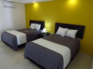 Postel nebo postele na pokoji v ubytování Casa Blanca Hotel