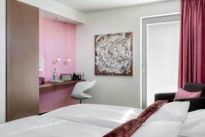 Postel nebo postele na pokoji v ubytování Hotel F-RITZ