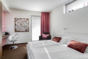 Postel nebo postele na pokoji v ubytování Hotel F-RITZ