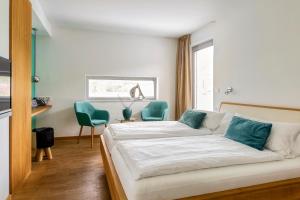 Llit o llits en una habitació de Hotel F-RITZ
