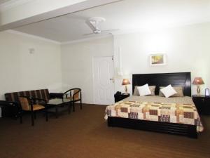 Ein Bett oder Betten in einem Zimmer der Unterkunft Stargaze Hotel & Apartment