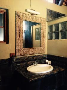 a bathroom with a sink and a mirror at Chinaka Game Lodge in Vivo