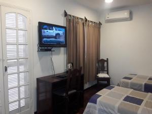 Giường trong phòng chung tại Hotel Casa Jardin